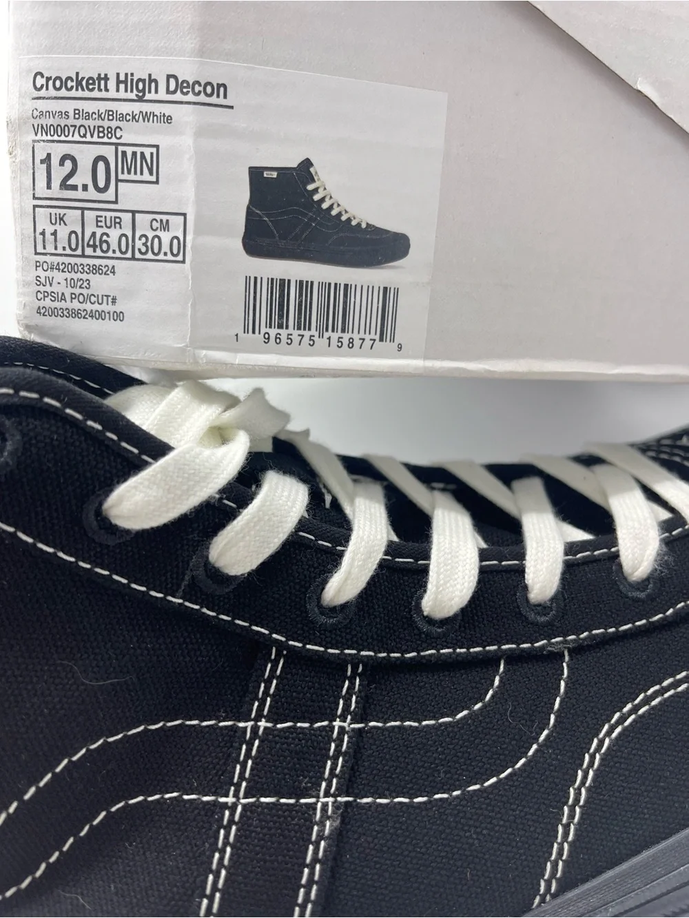 Vans Men’s High-Top Canvas Sneakers in Black and White